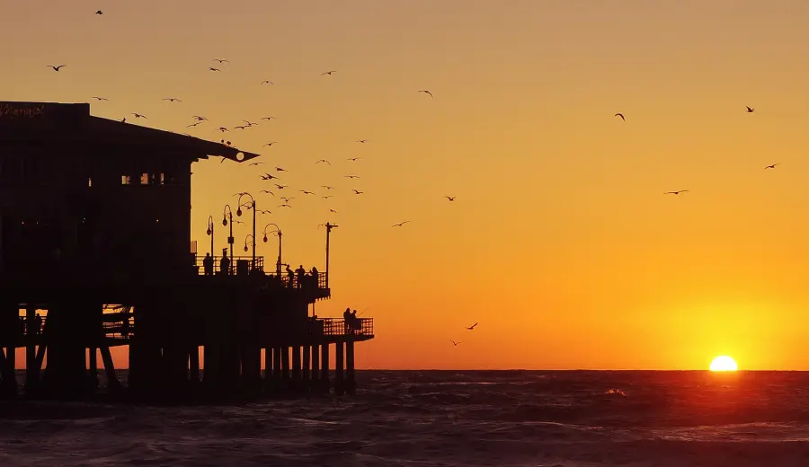 Santa Monica Pier silhouetted against the sunset